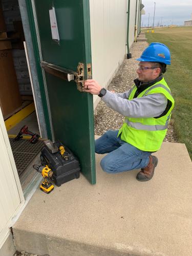 Locksmiths Isaiah and Parker manned a multi-door project installing exit devices and push plates for Bayer Crop Science here in Grinnell.